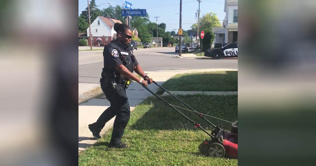 officer-mows-lawn