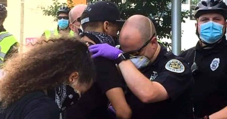 police-officer-prays-with-protester