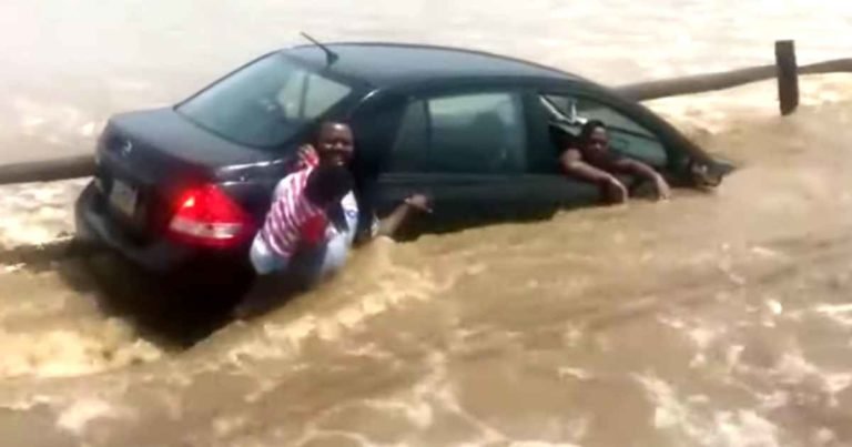 man-saves-family-from-flood-water