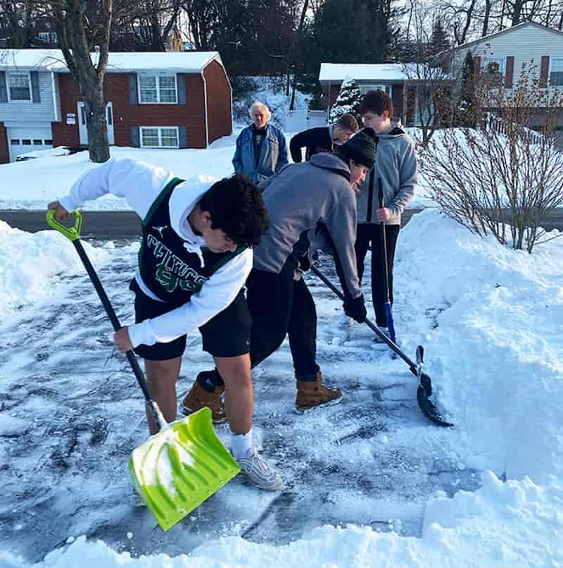 football-athletes-shovel-driveways-3