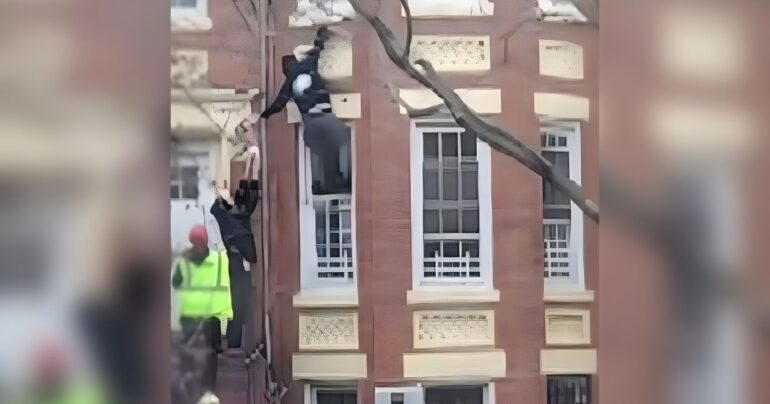 man scales burning building Brooklyn