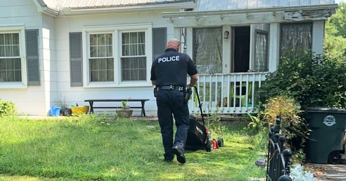 police officer mowing lawn
