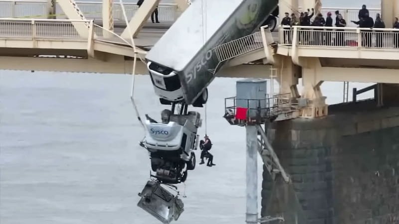 semi truck dangling over Louisville bridge