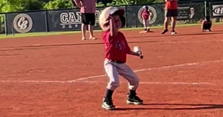 little boy dancing at baseball game