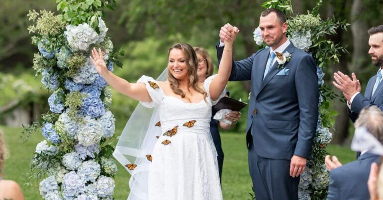 butterflies land on brides dress