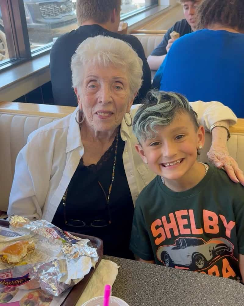 boy dine with elderly woman