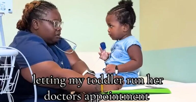 little girl chatting with nurse