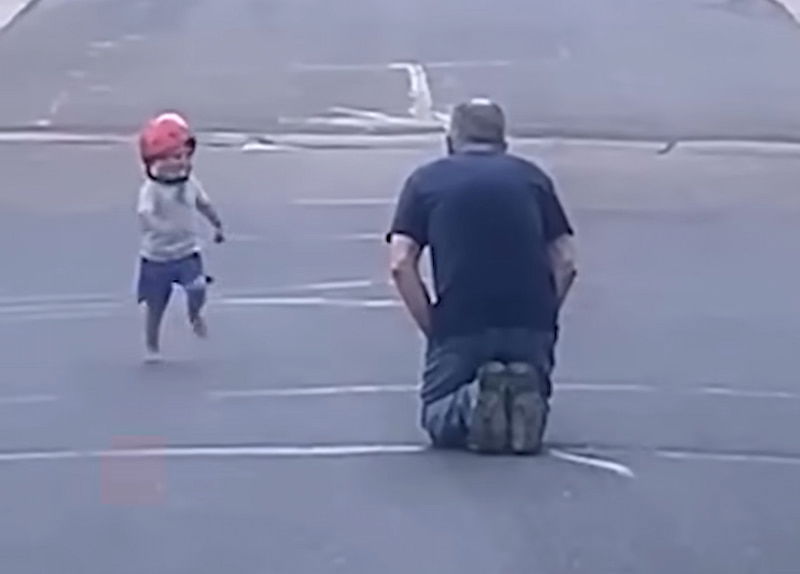 little boy runs to hug grandpa