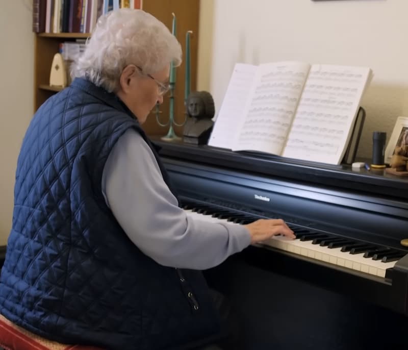elderly piano player